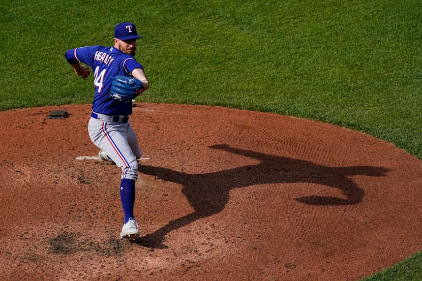 Texas Rangers starting pitcher Andrew Heaney throws a pitch to the Baltimore Orioles during...