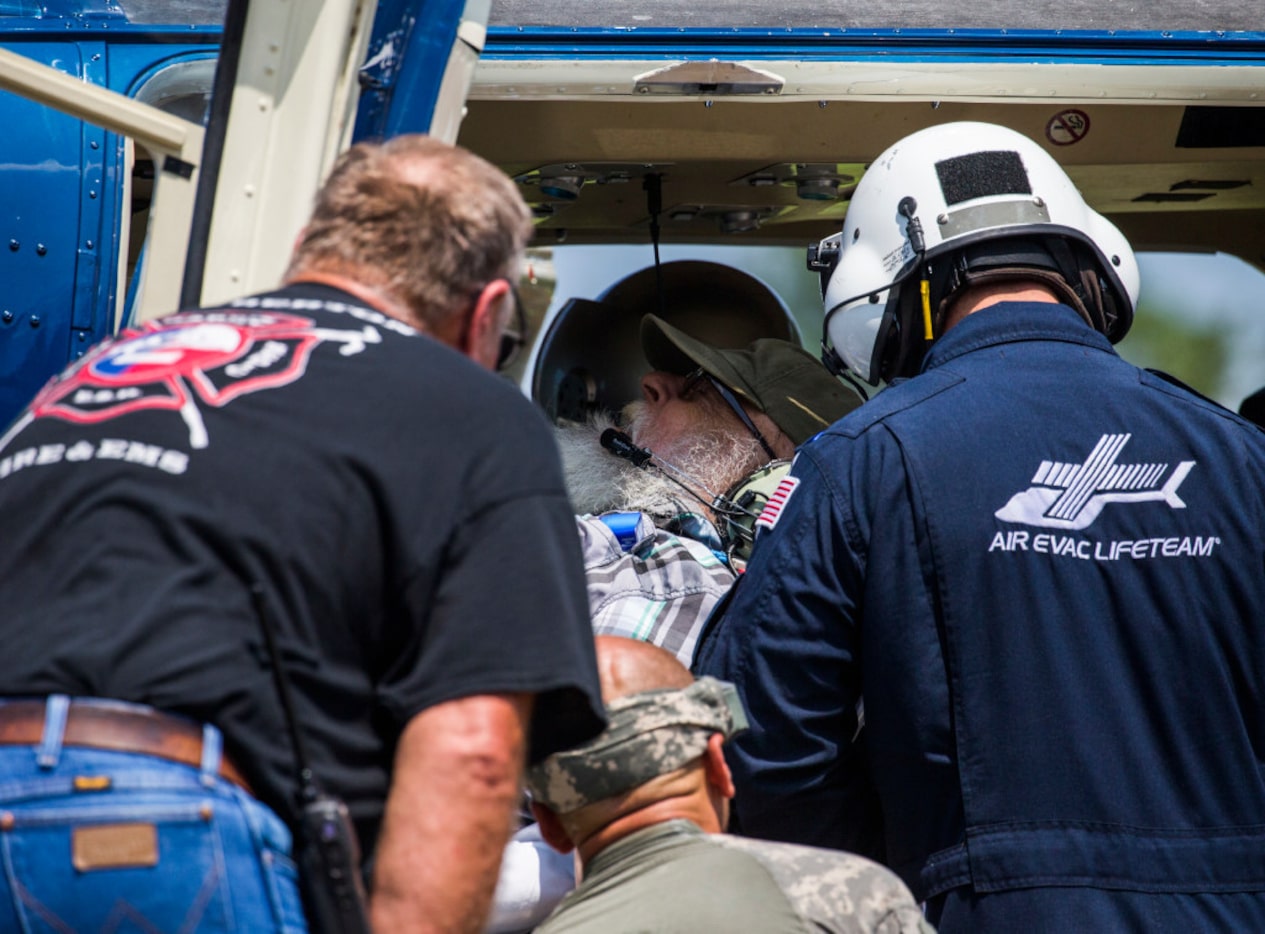 Hendrix Parks, center, is treated inside a medical helicopter by Lumberton EMS and...