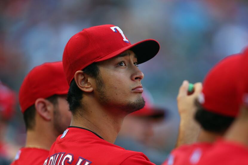 ARLINGTON, TX - MAY 10:  Yu Darvish #11 of the Texas Rangers sits in the dugout during a...