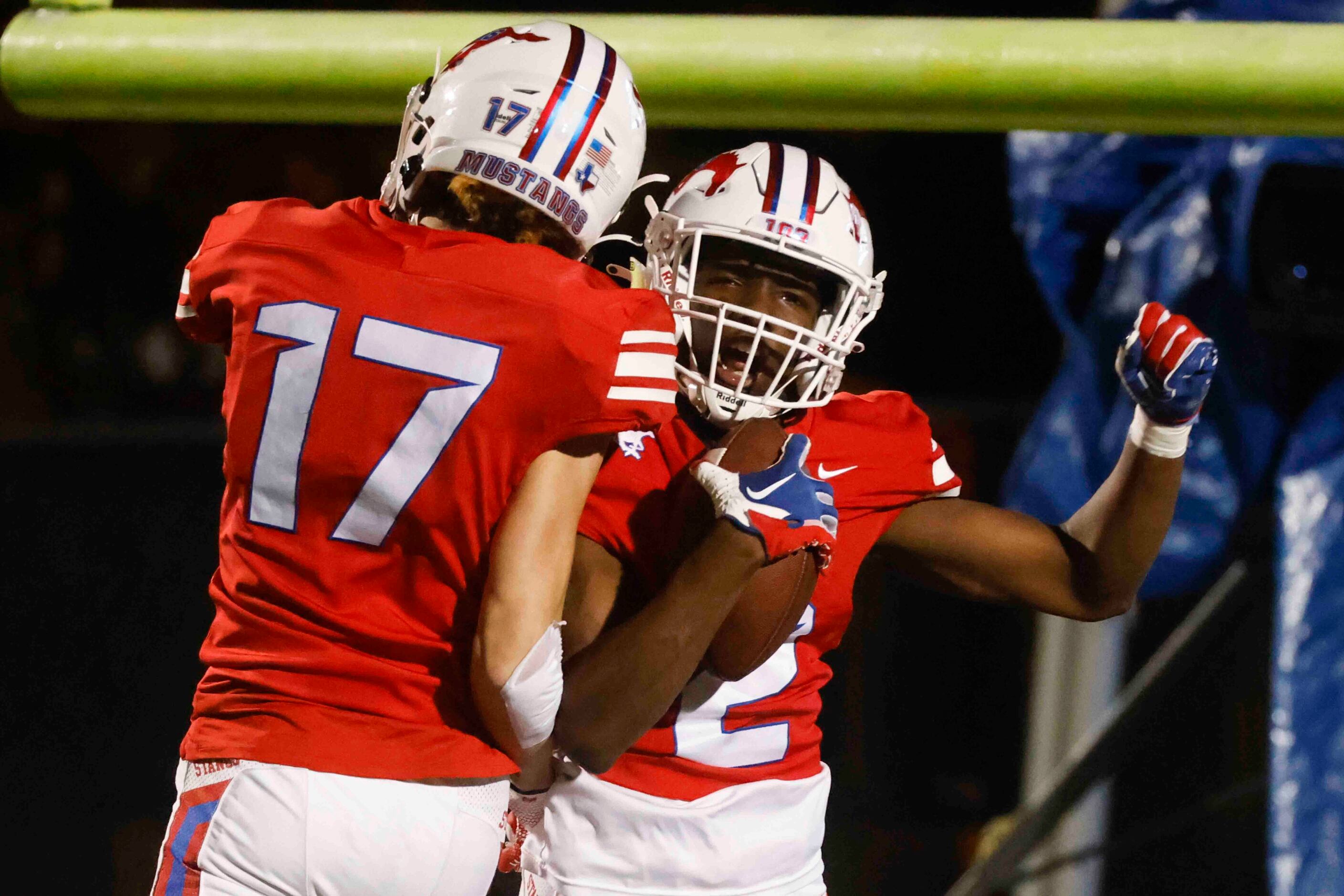 Grapevine High’s Derrius Burns (2), right, and Sammy Kelly (17) celebrates a touchdown...