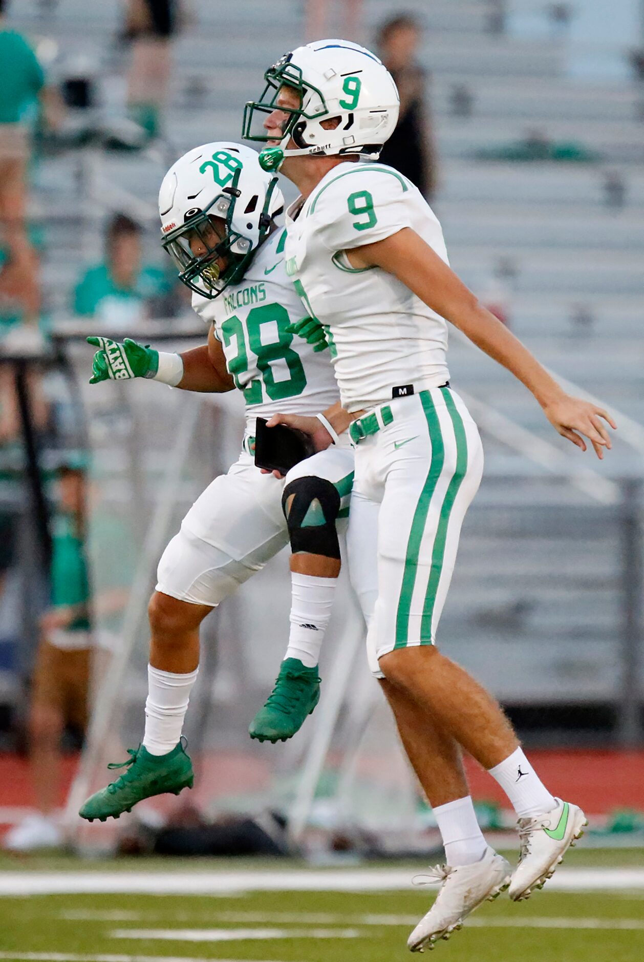 Lake Dallas High School kicker Preston Gregg (9) and Lake Dallas High School cornerback...