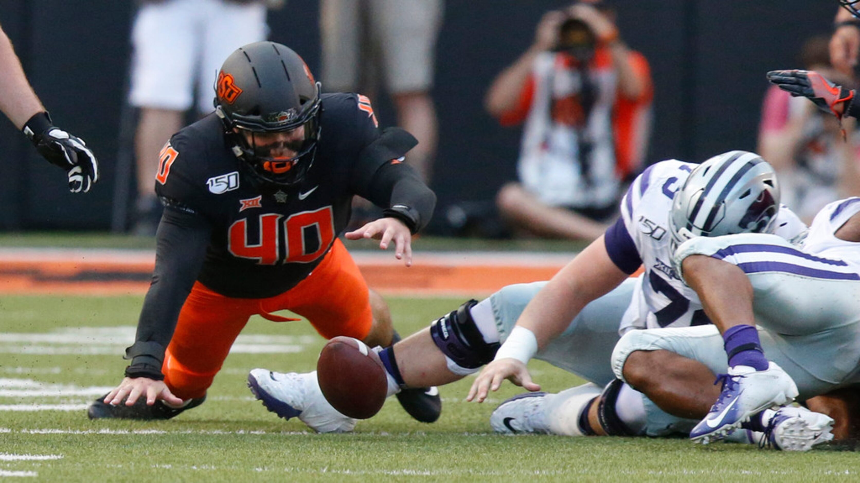 Oklahoma State defensive end Brock Martin (40) dives for a K-State fumble in the first half...