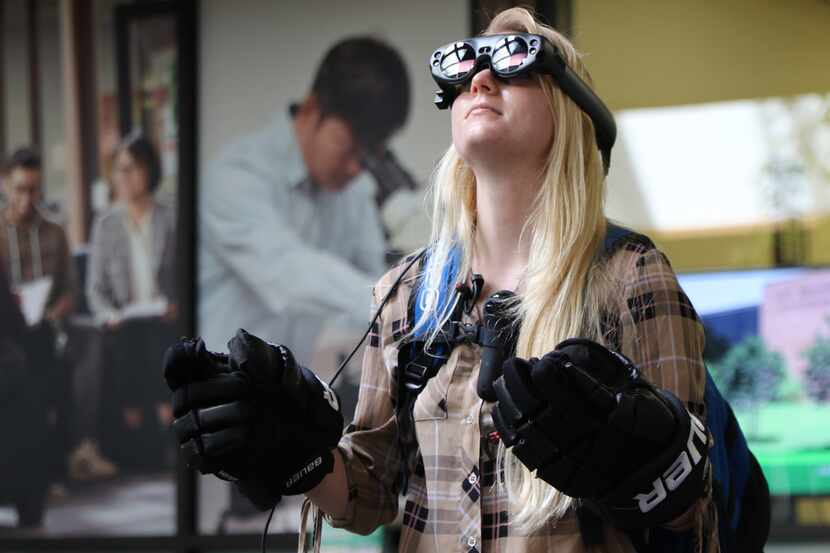 Sophomore Lauren Caves tested augmented reality goggles made by students at the UNT College...
