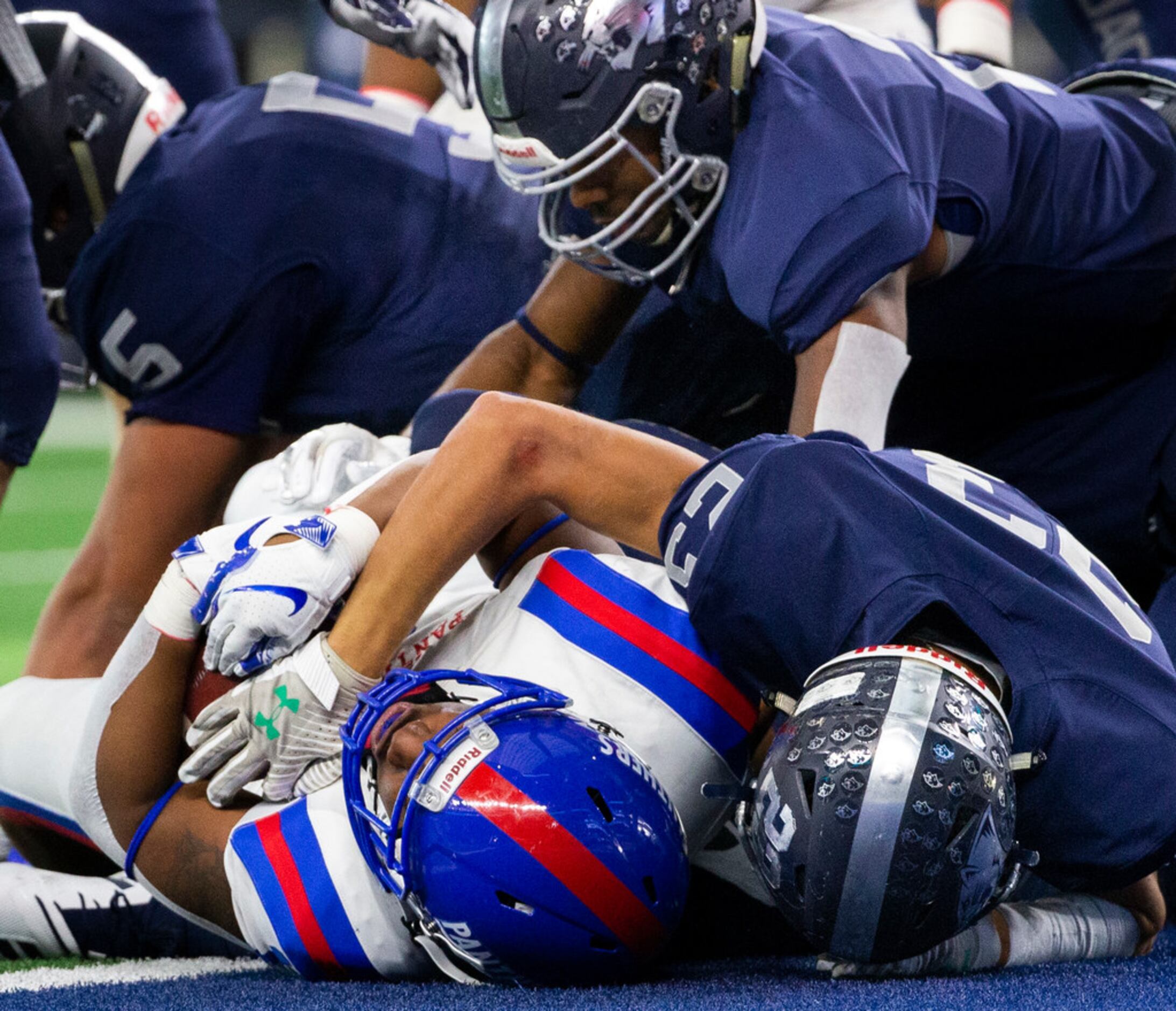 Duncanville running back Trysten Smith (right,1) pushes past Flower Mound defense to score a...