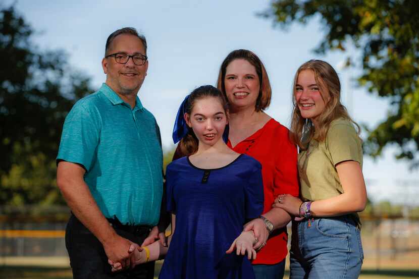 The Sparks family — Chuck (from left), Shelby, Lauren and Allie — gather at Bear Creek Park...