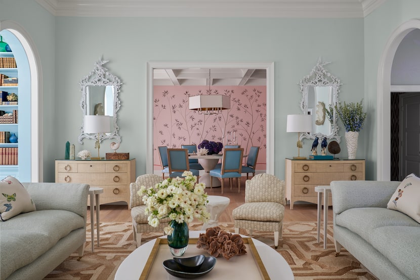 Living room with pale blue walls, shagreen dressers, abaca rug, blue and brown color palette