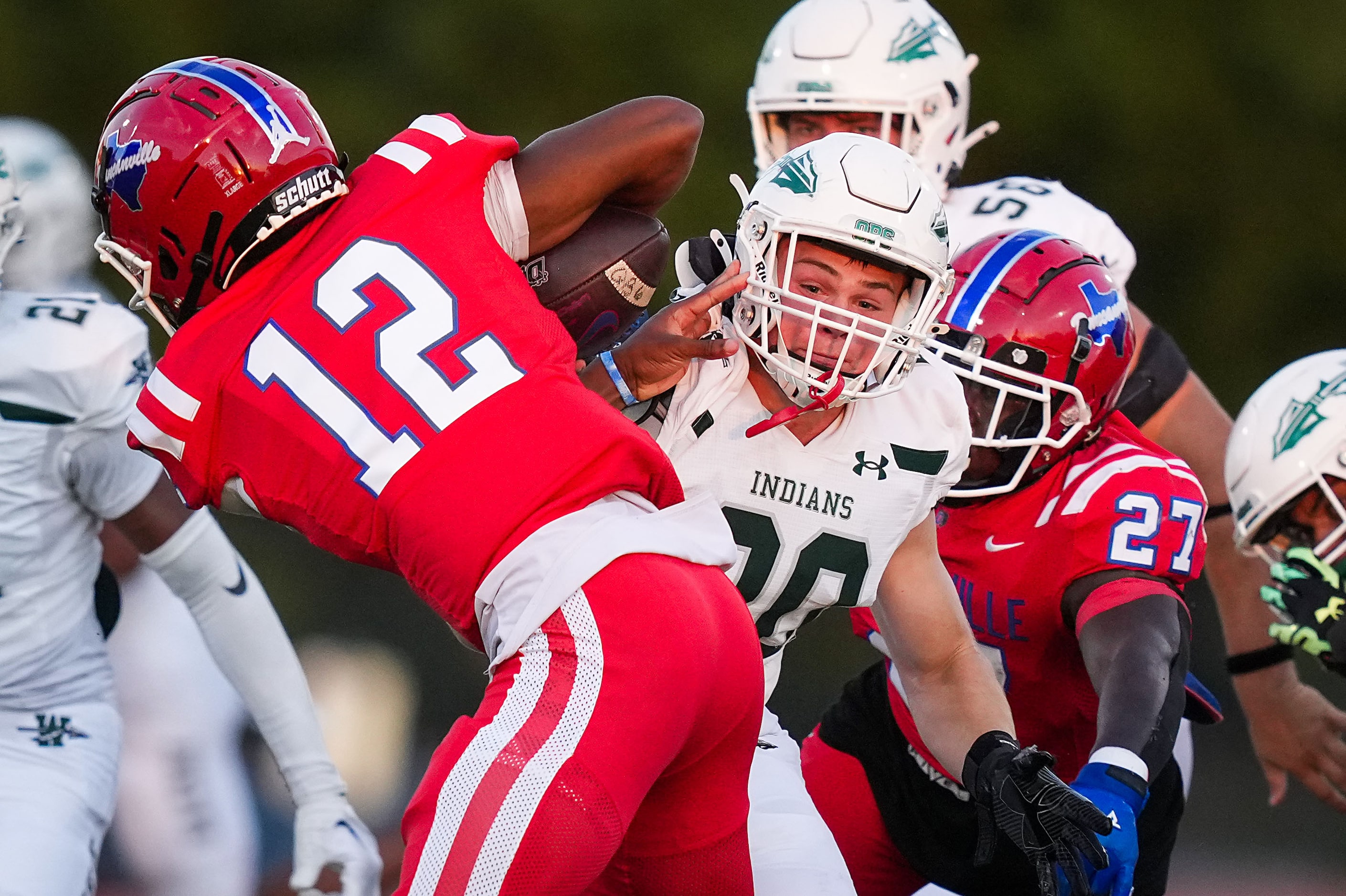 Duncanville quarterback Keelon Russell (12) scrambles away from Waxahachie linebacker Kaden...