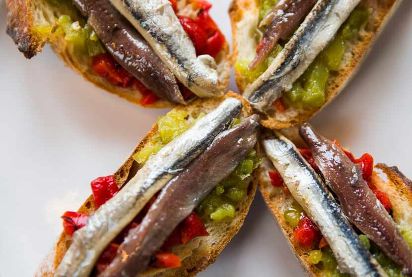 Dallas Morning News members also ate "matrimonio," or dark and white anchovies on toast, at...