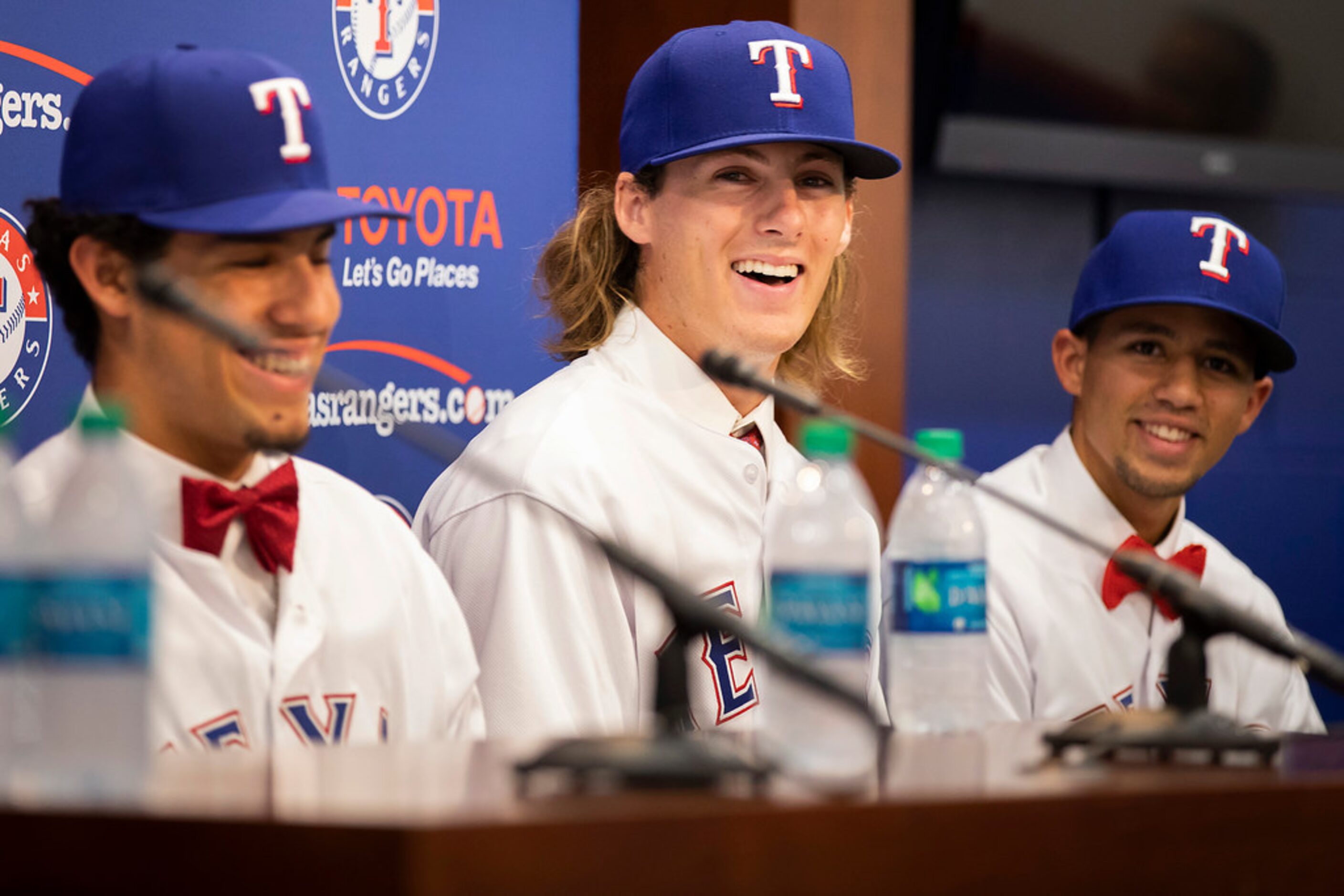 Texas Rangers 4th round pick, pitcher Mason Englert  of Forney (TX) High School, (center)...