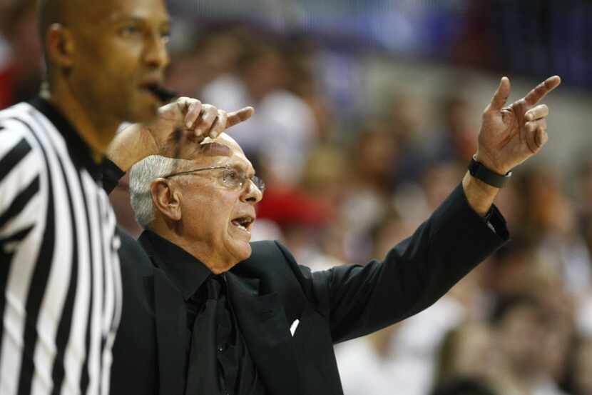 SMU coach Larry Brown yells at his team as they play Louisville at Moody Coliseum in Dallas...