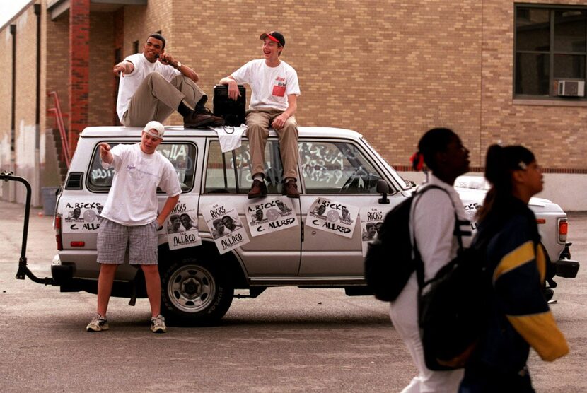 Hillcrest High School junior Matt Wilson  (standing) campaigns with Colin Allred (left) and...