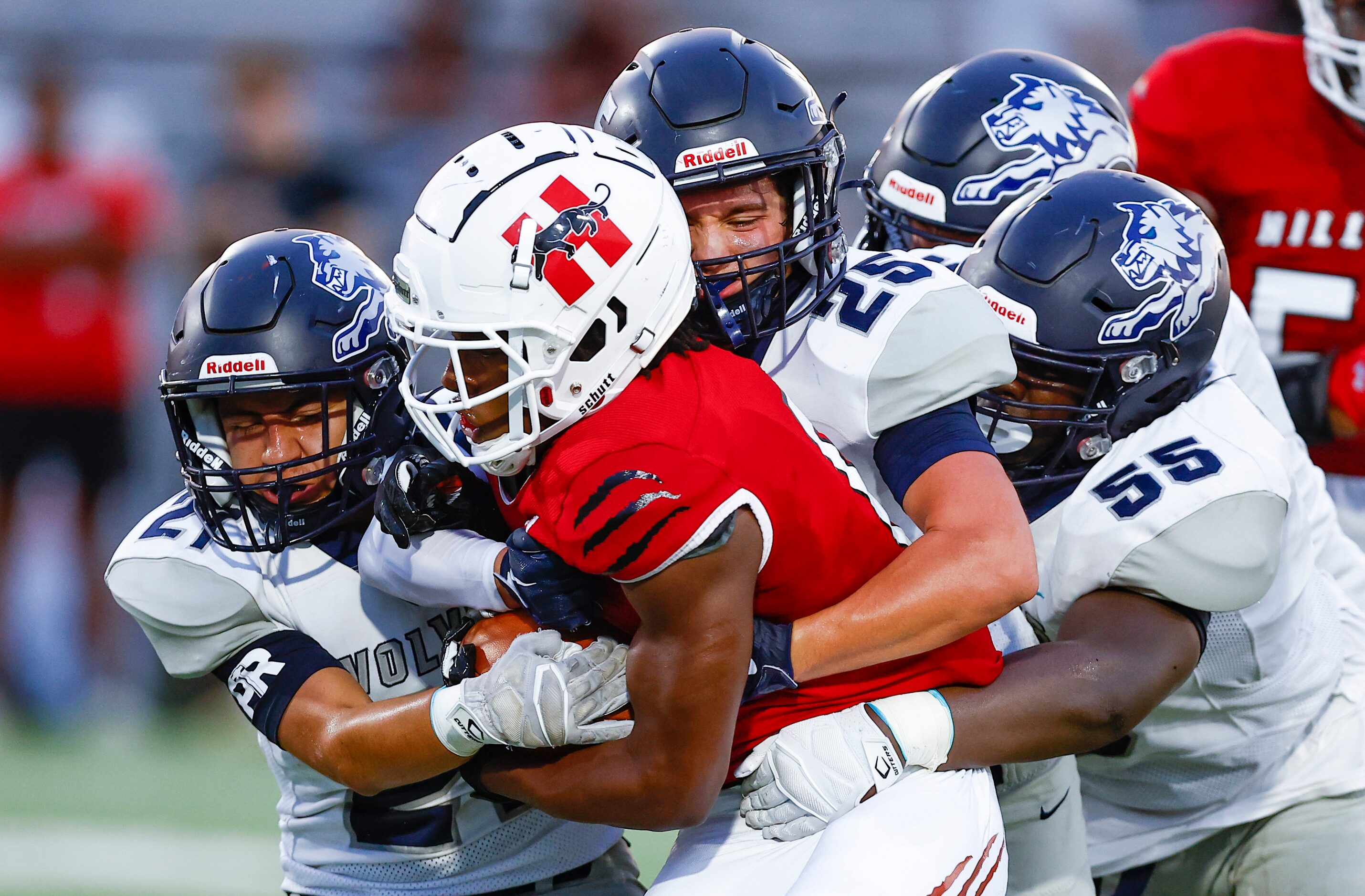 Hillcrest senior running back Jaden Hodge (6) battles several Carrollton Ranchview defensive...