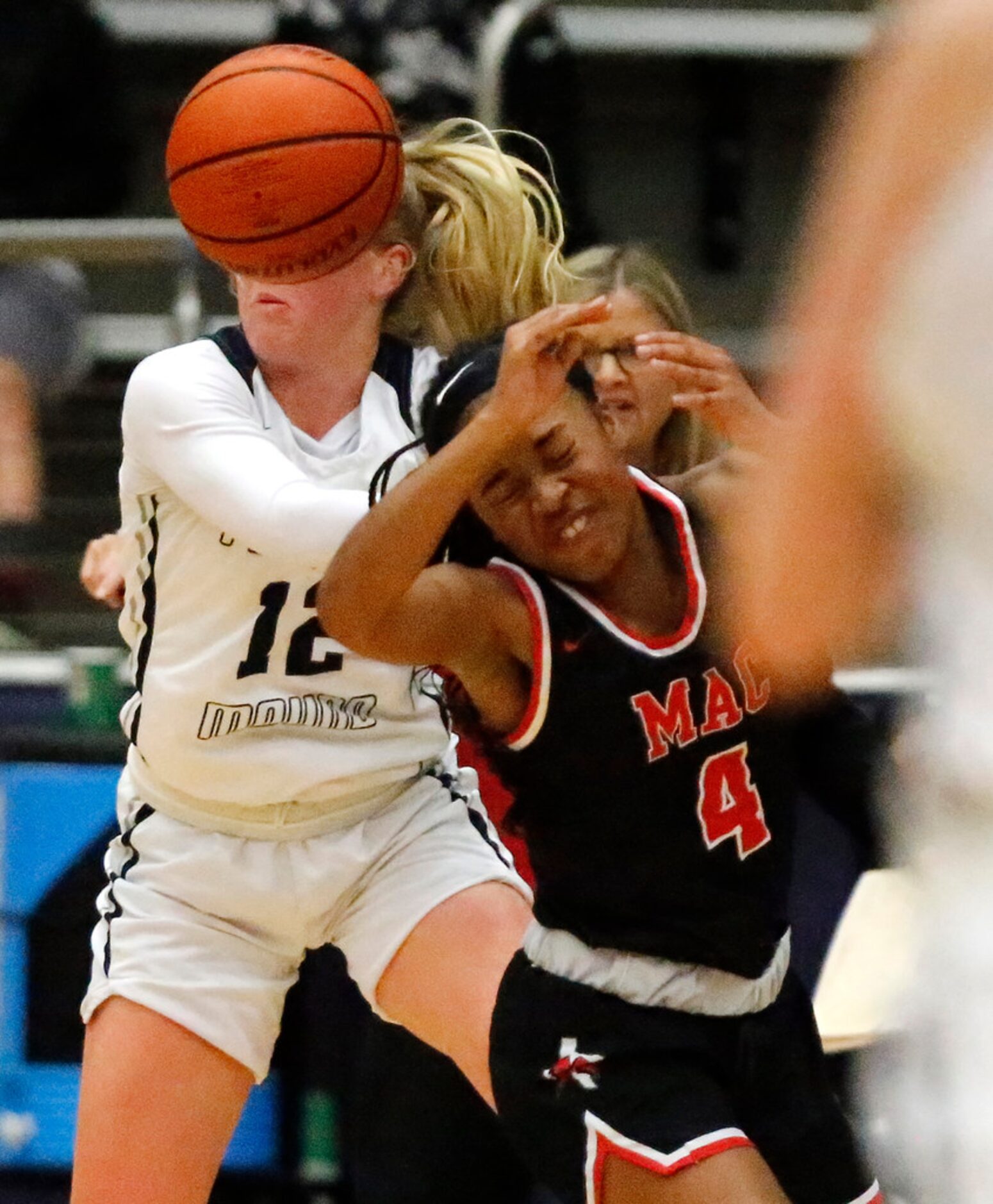 Flower Mound High School guard Kayla Wallace (12) and Irving MacArthur High School guard...