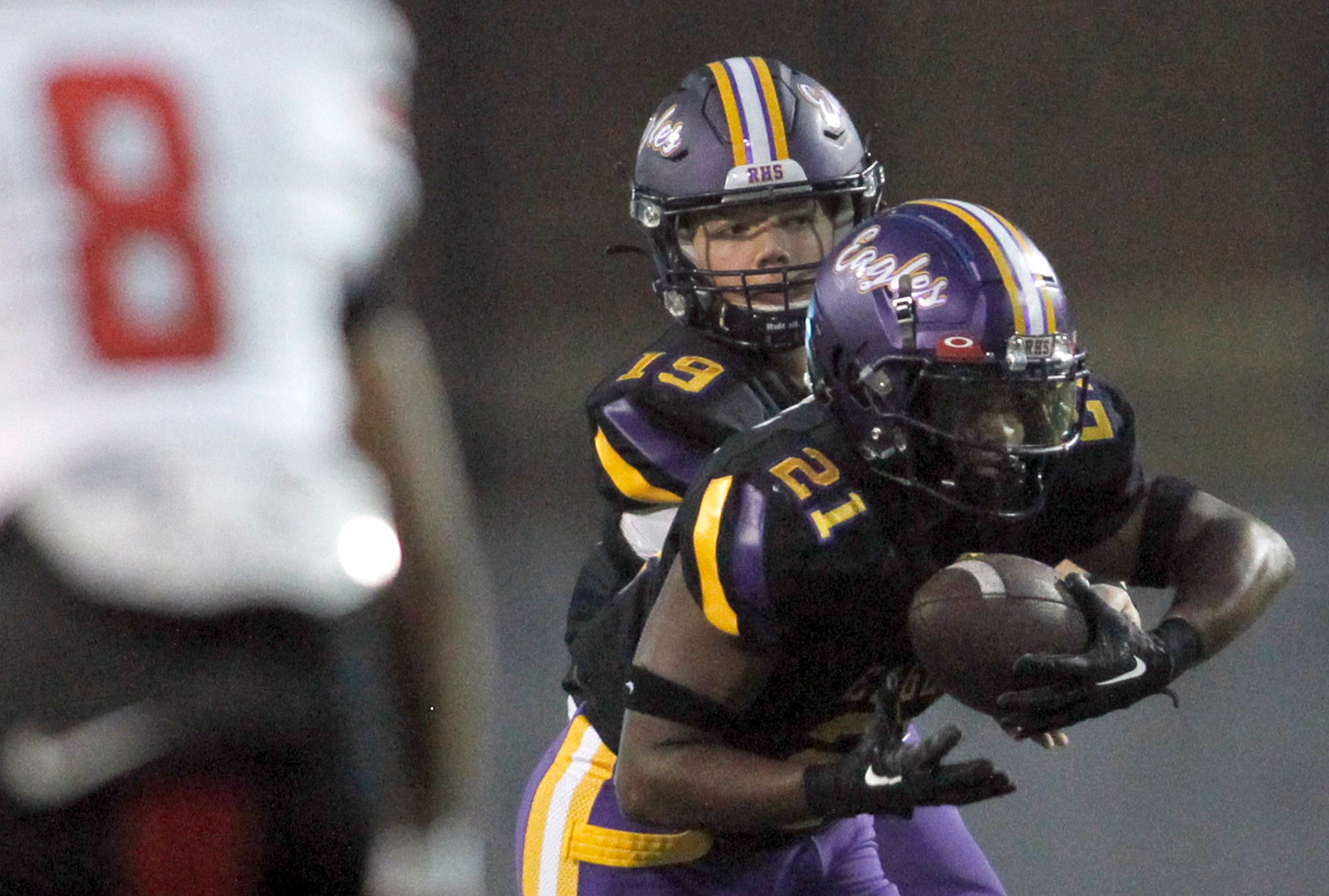 Richardson quarterback Lucas Lawyer (19), center, hands the ball off to running back Kevin...