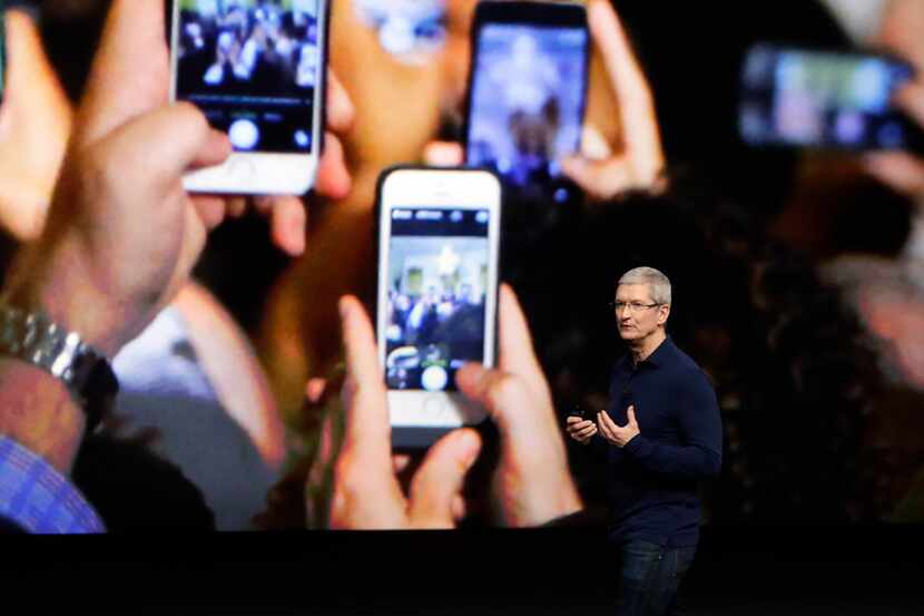 Apple CEO Tim Cook announces the new iPhone 7 during an event to announce new products...