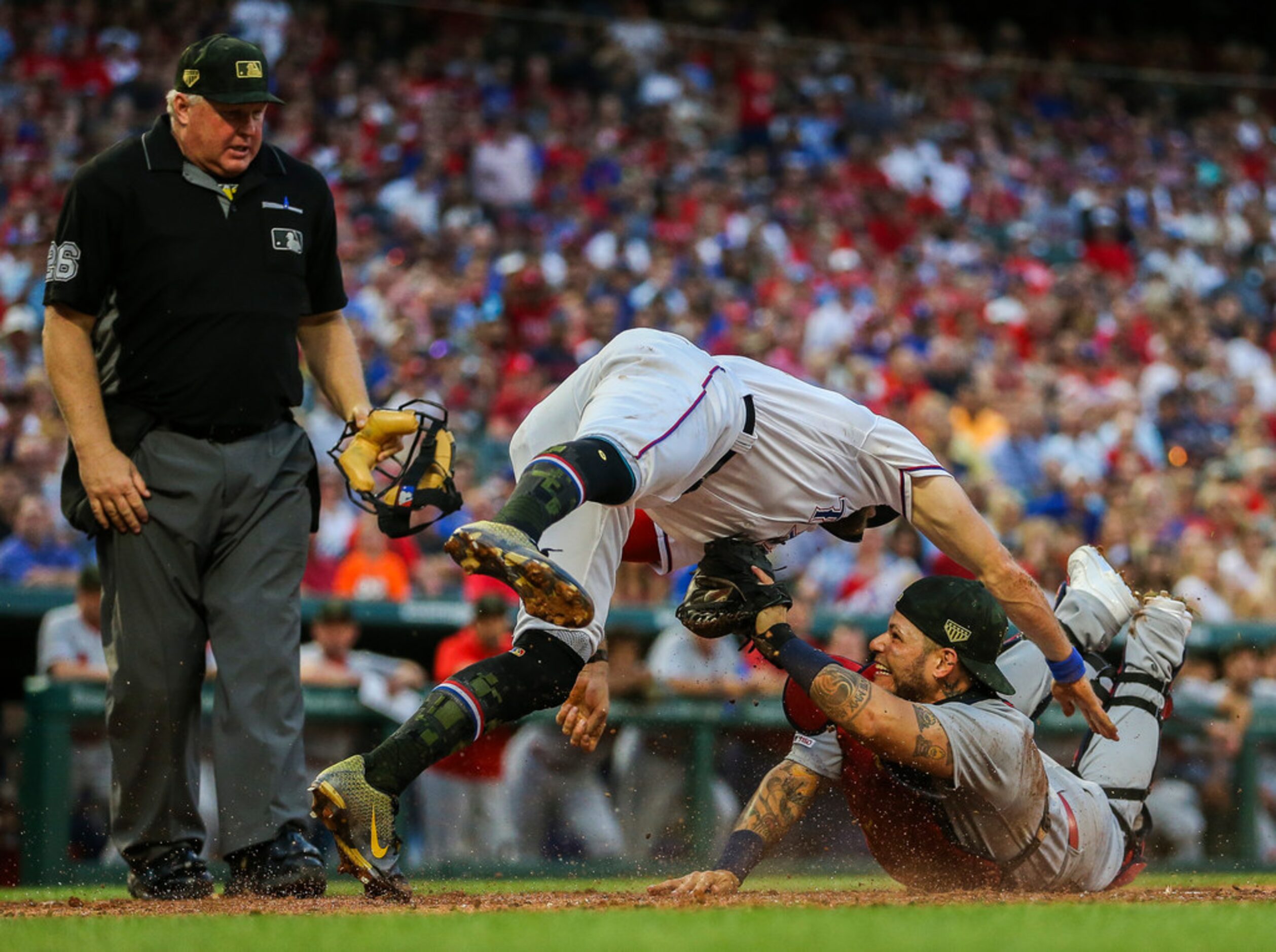 St. Louis Cardinals catcher Yadier Molina (4) tags out Texas Rangers designated hitter...