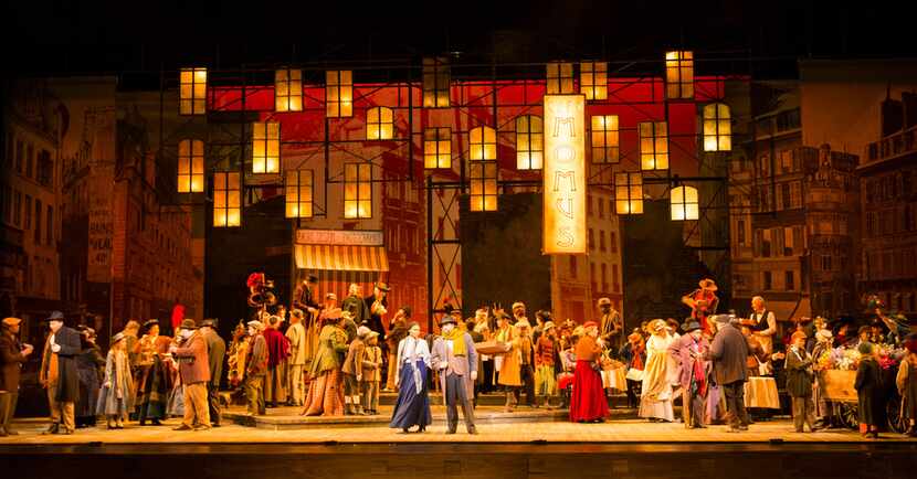 The ensemble performs in Act 2 during the final dress rehearsal of La Bohème presented by...