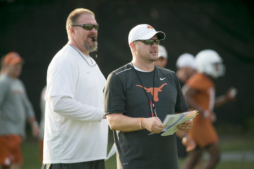 Texas Strength and Conditioning coach Yancy McKnight oversees practice with head coach Tom...