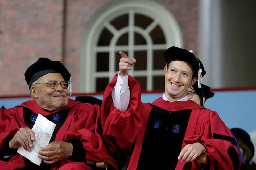 Facebook CEO and Harvard dropout Mark Zuckerberg, right, gestures as actor James Earl Jones,...
