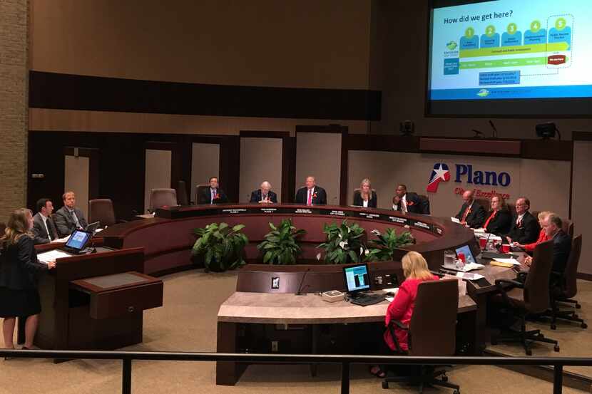 Plano planning director Christina Day, far left, talks to the Plano City Council about the...