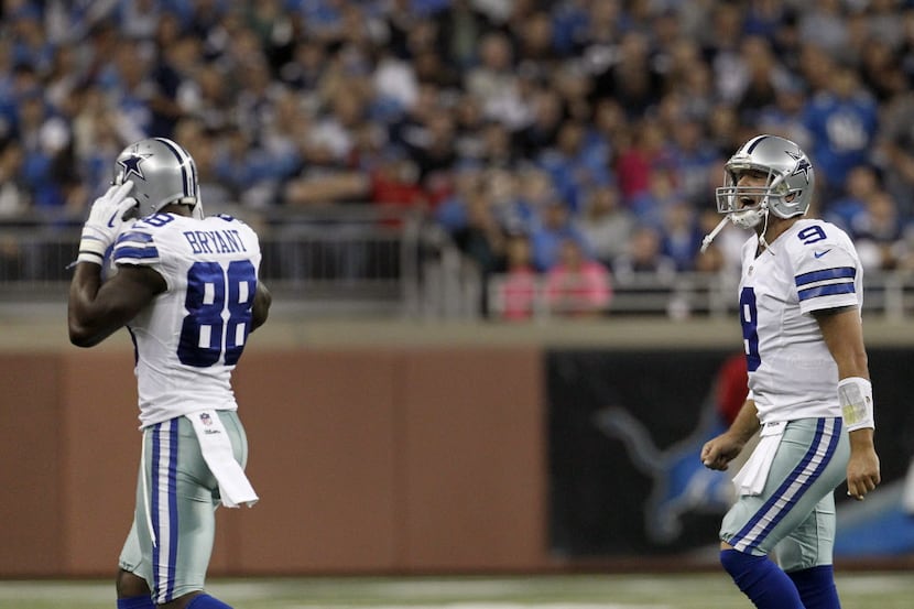 Dallas Cowboys quarterback Tony Romo (9) yells at Dallas Cowboys wide receiver Dez Bryant...