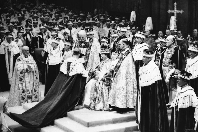 Queen Elizabeth II sits in the Chair of Estate in Westminster Abbey, London on June 2, 1953,...