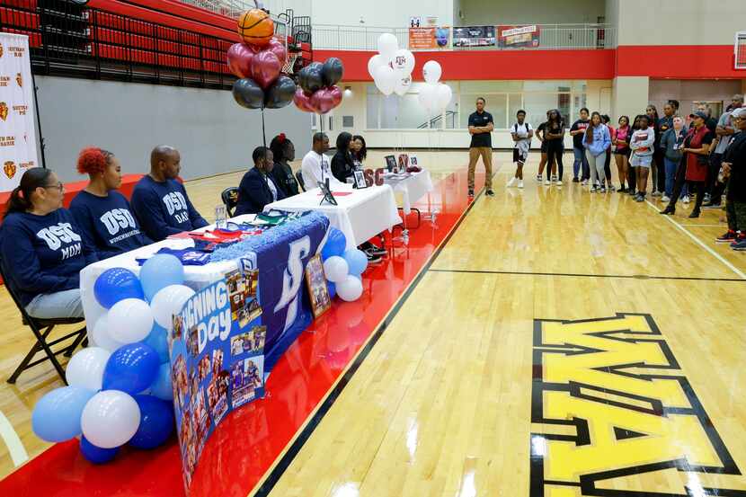 Students and family members gather during a national letter of intent signing ceremony at...