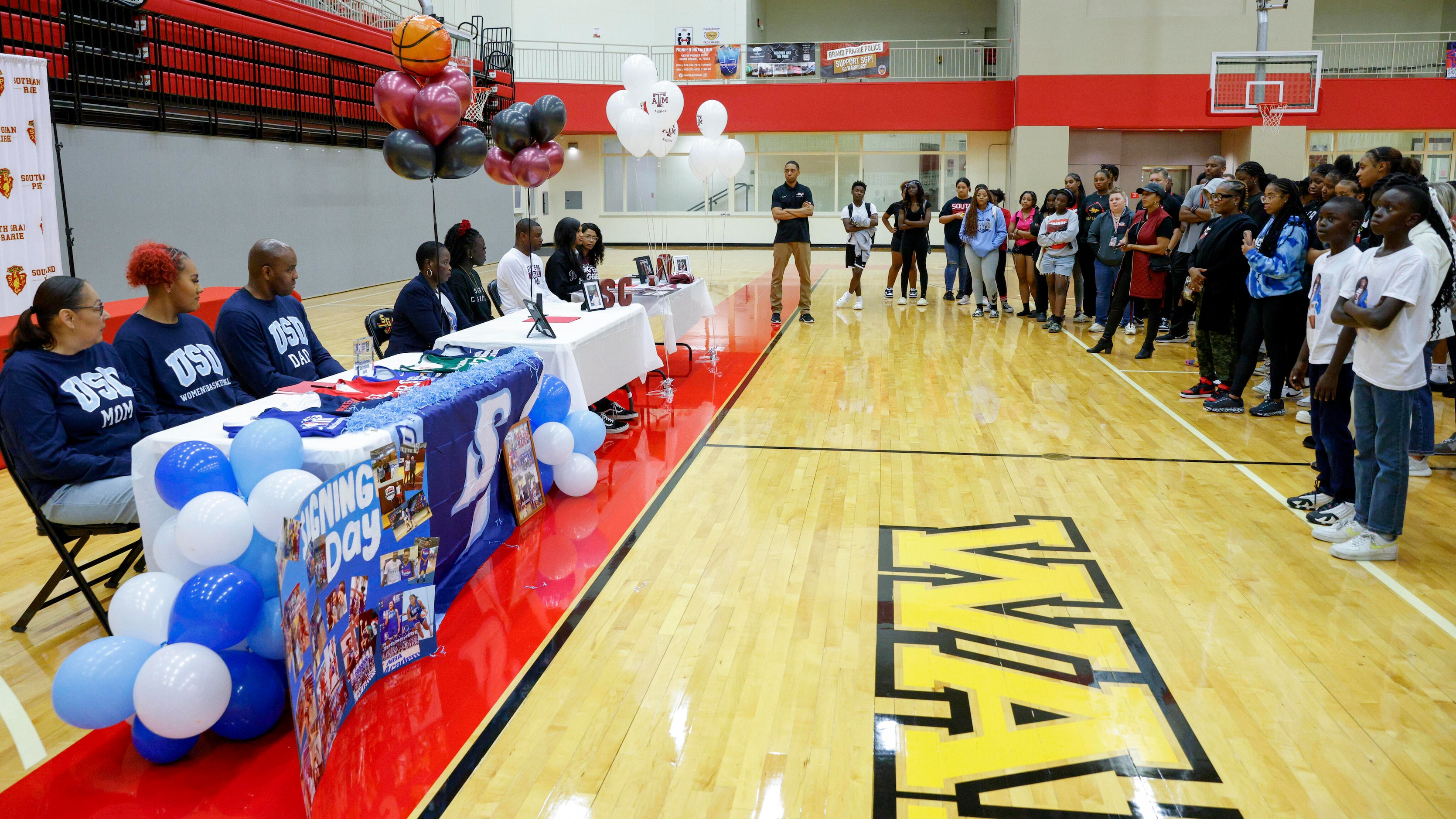 Students and family members gather during a national letter of intent signing ceremony at...