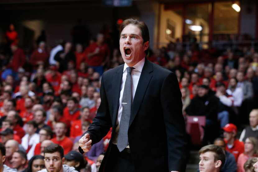 SMU head coach Tim Jankovich directs his players from the bench in the first half an NCAA...