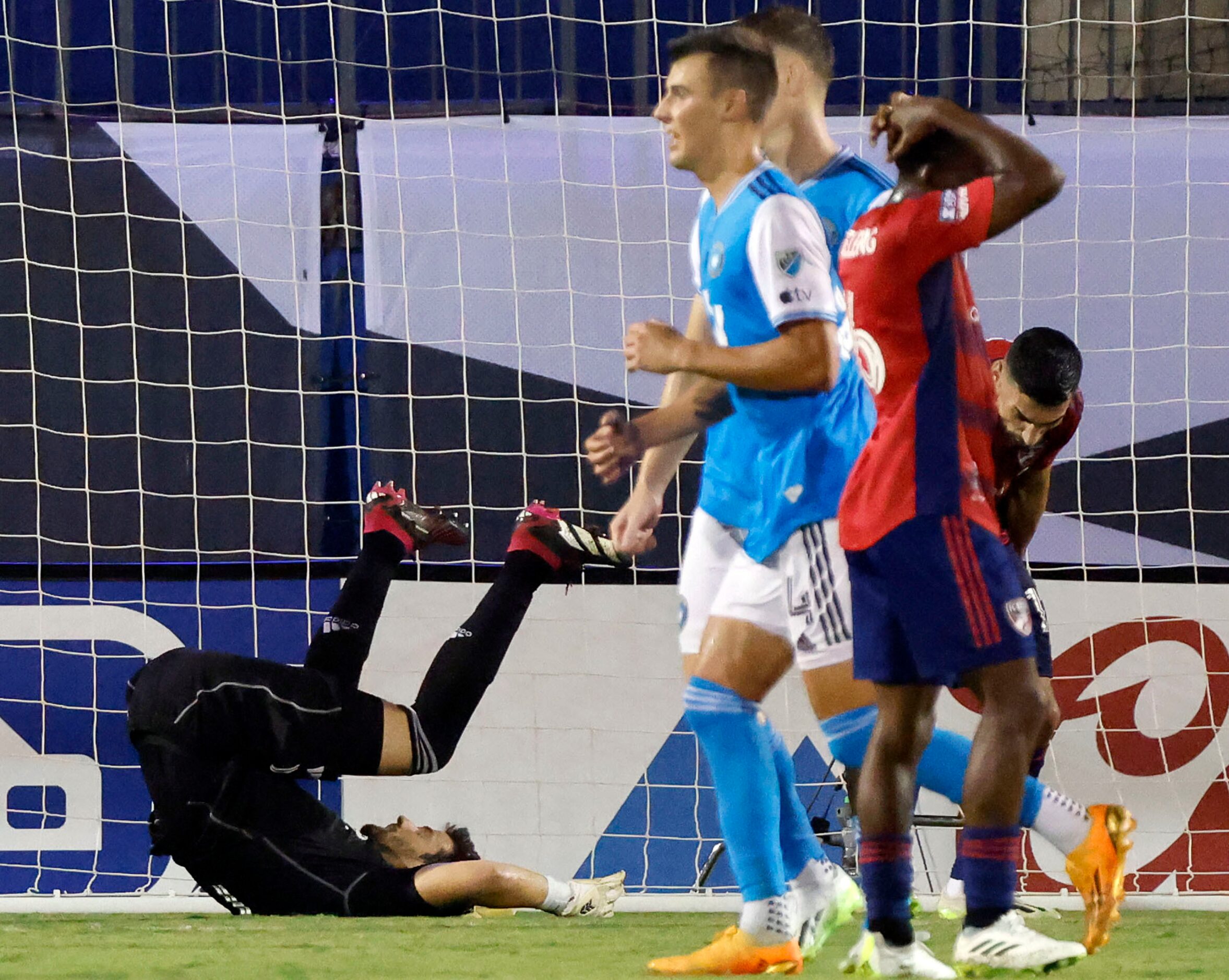 FC Dallas goalkeeper Jimmy Maurer (1) falls to the turf after letting the tying goal get...