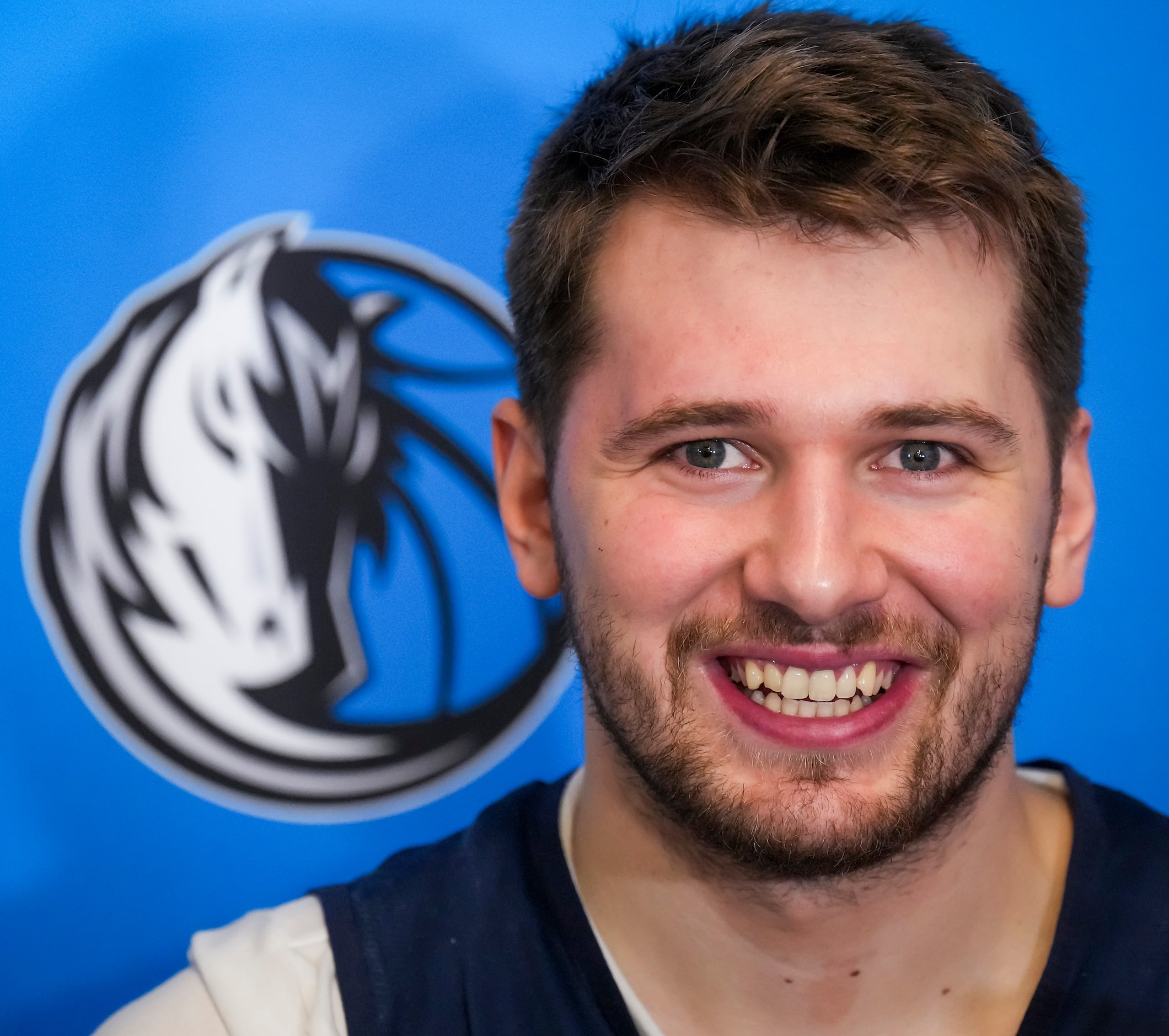 Dallas Mavericks guard Luka Doncic smiles he addresses reporters after the team practiced in...