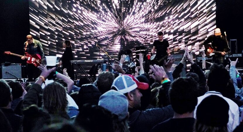 The audience takes in Slowdive's performance. 