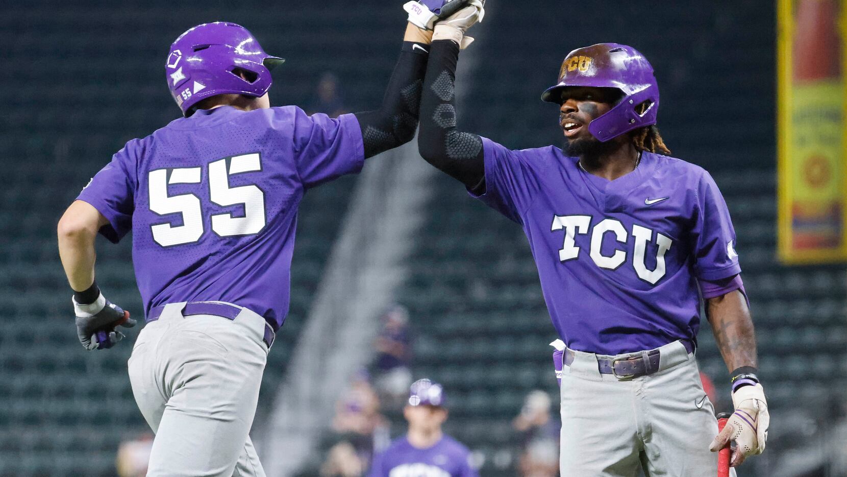 TCU infielders Brayden Taylor (55) and Tre Richardson cheers after a homer by Taylor during...