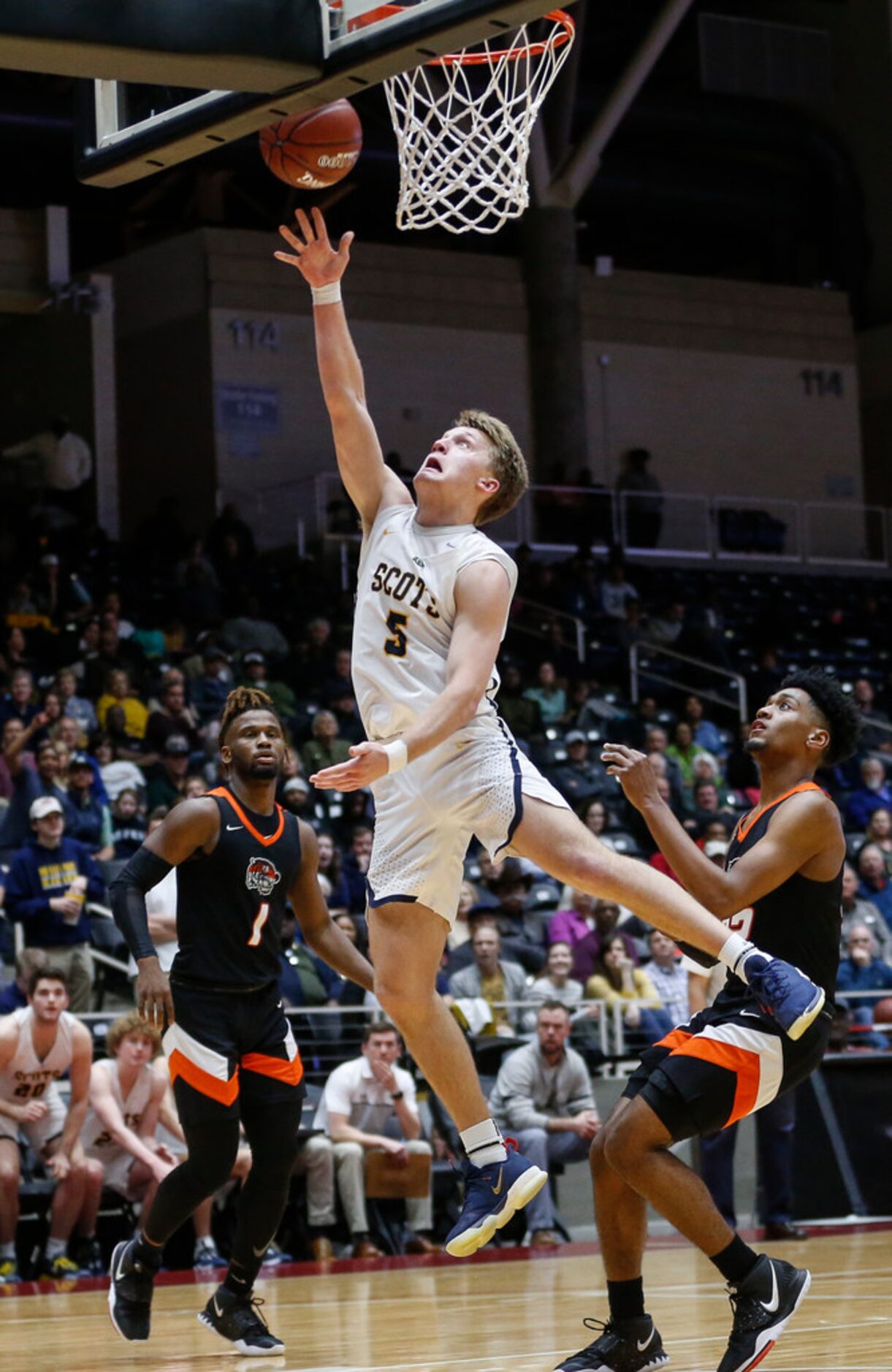 Highland Park's Drew Scott (5) puts up a shot during the second half of a boys basketball...