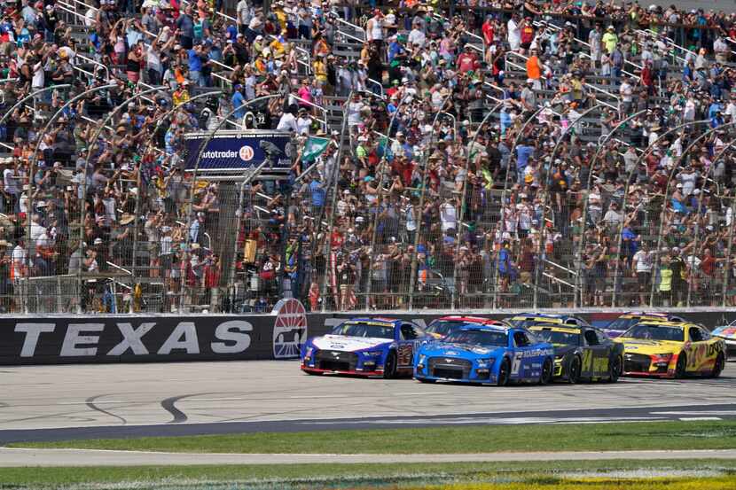 The green flag starts a NASCAR Cup Series auto race at Texas Motor Speedway in Fort Worth,...