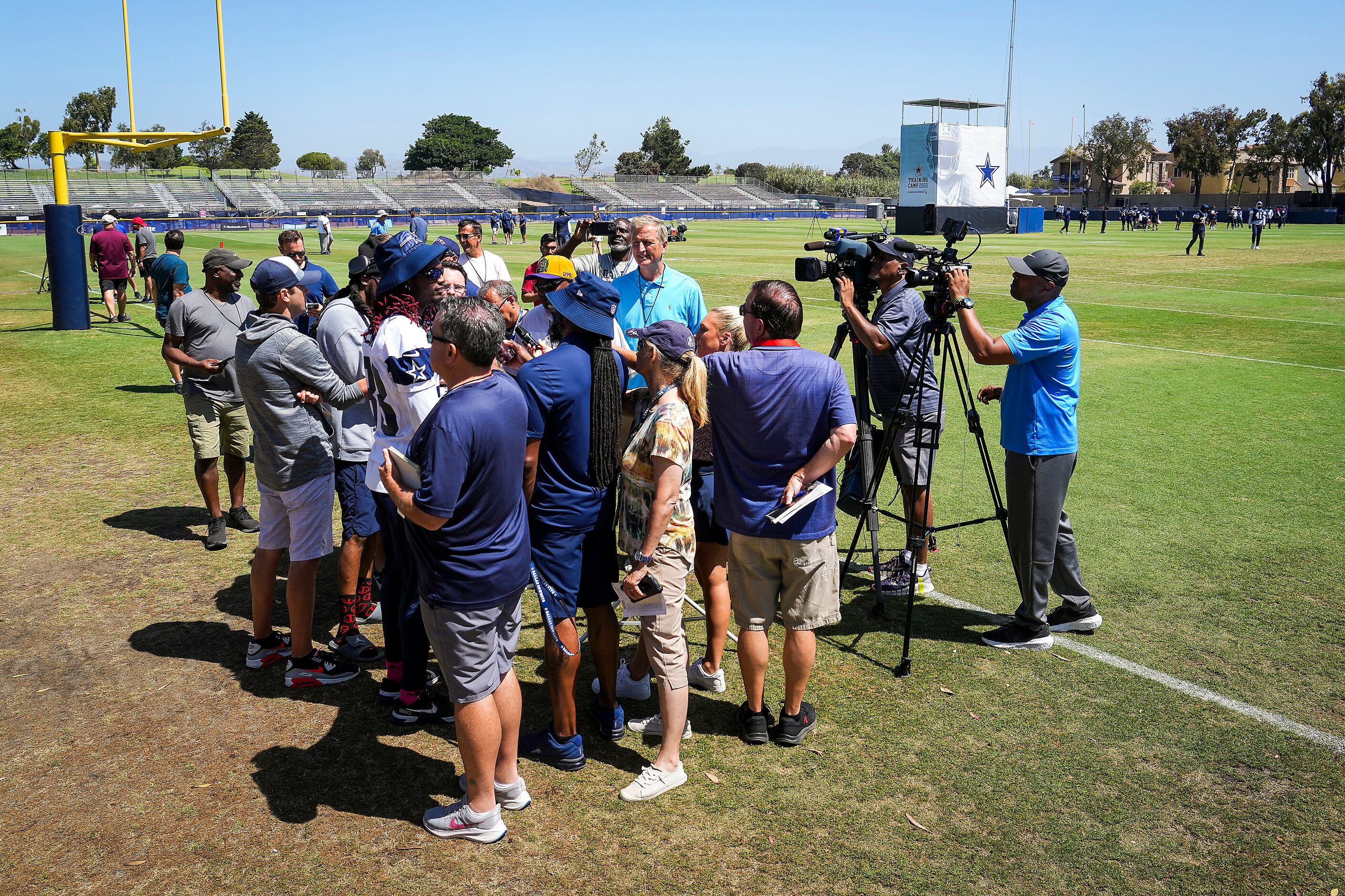 Dallas Cowboys wide receiver CeeDee Lamb talks with reporters after a training camp...