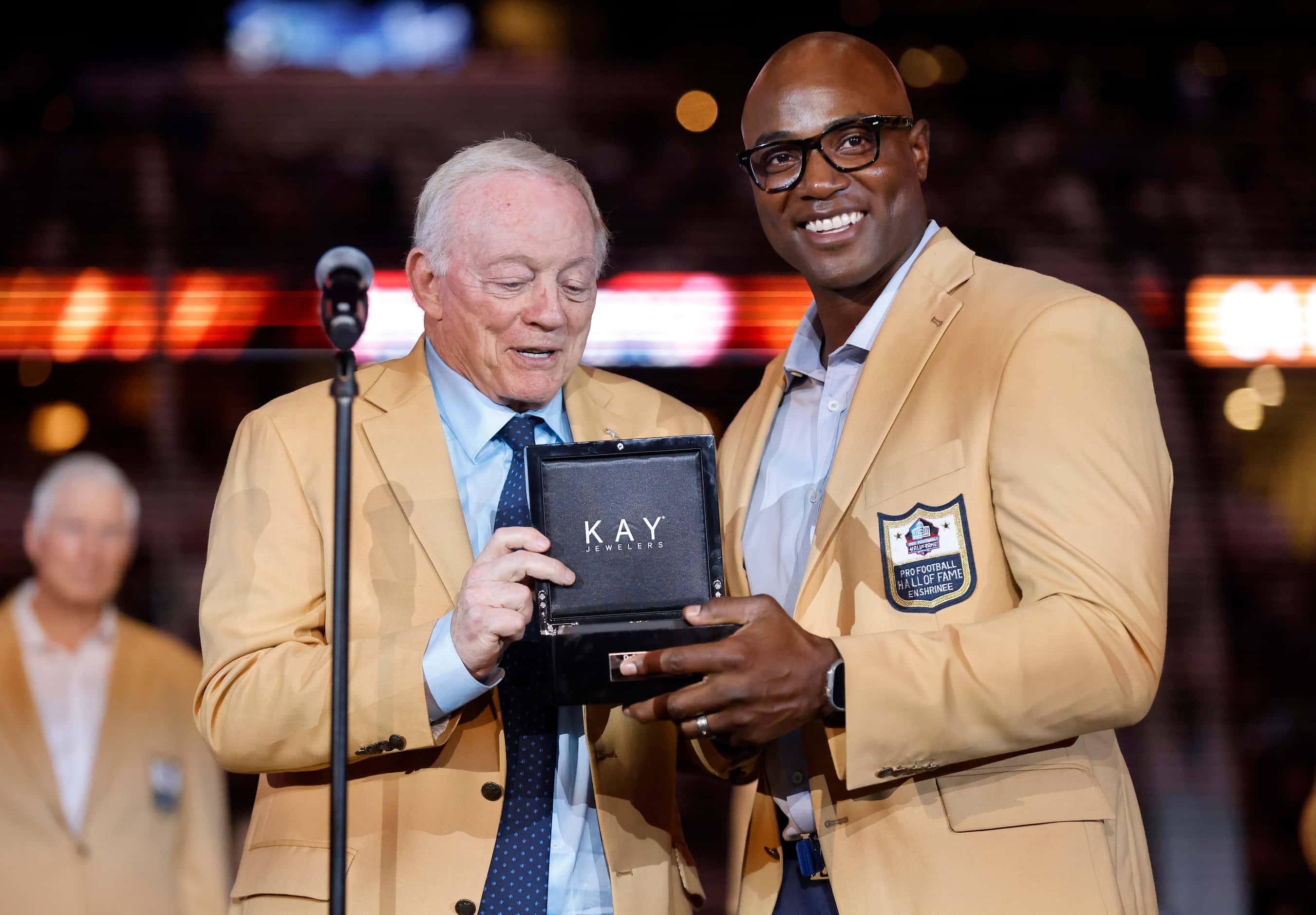 Dallas Cowboys owner Jerry Jones (left) presents Pro Football Hall of Famer Demarcus Ware...