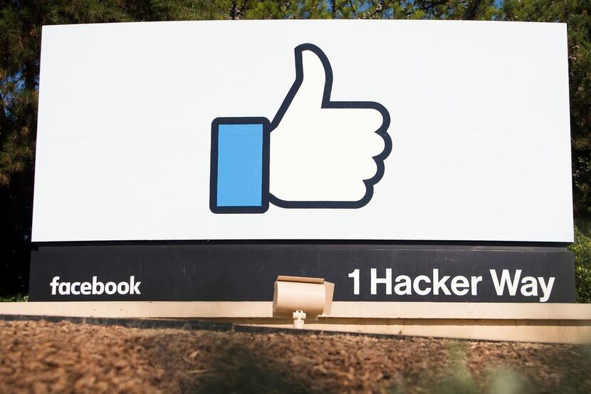 The Facebook sign and logo is seen in Menlo Park, Calif. Facebook has denied allegations...