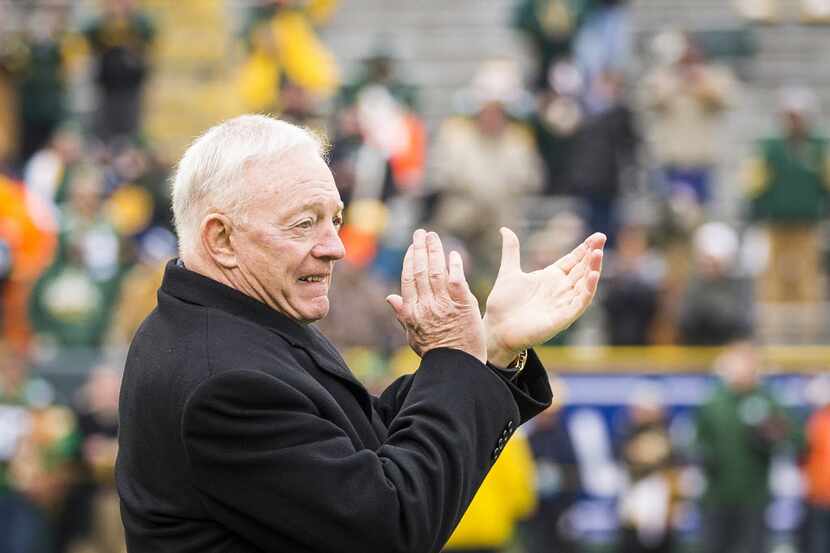Dallas Cowboys owner Jerry Jones cheers his team as they warm up before an NFC divisional...