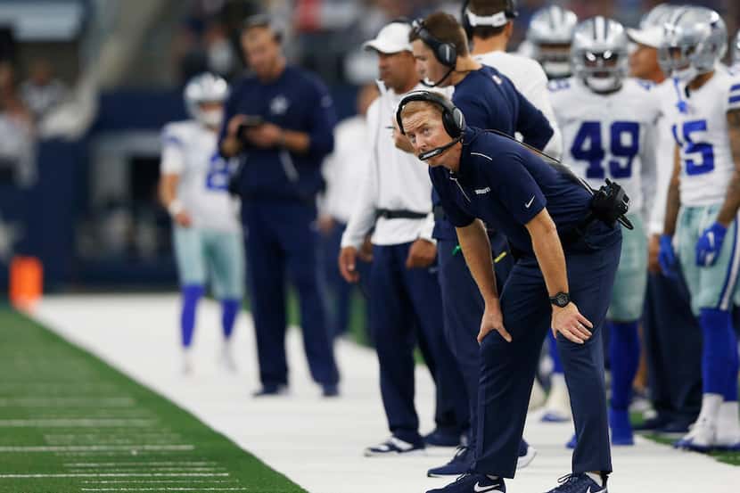 Dallas Cowboys head coach Jason Garrett looks up toward the scoreboard during the second...