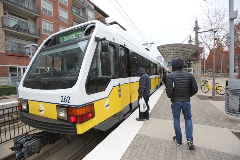 DMN reporter Brendan Meyer boards the train at the DART station near Baylor hospital near...