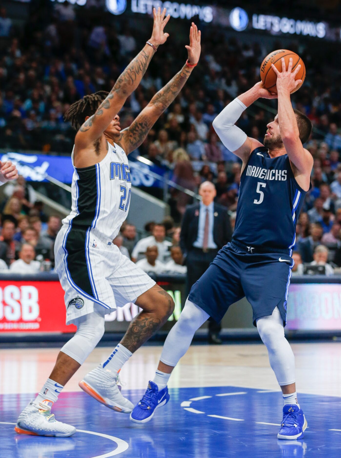 Dallas Mavericks guard J.J. Barea (5) puts up a shot past Orlando Magic guard Markelle Fultz...