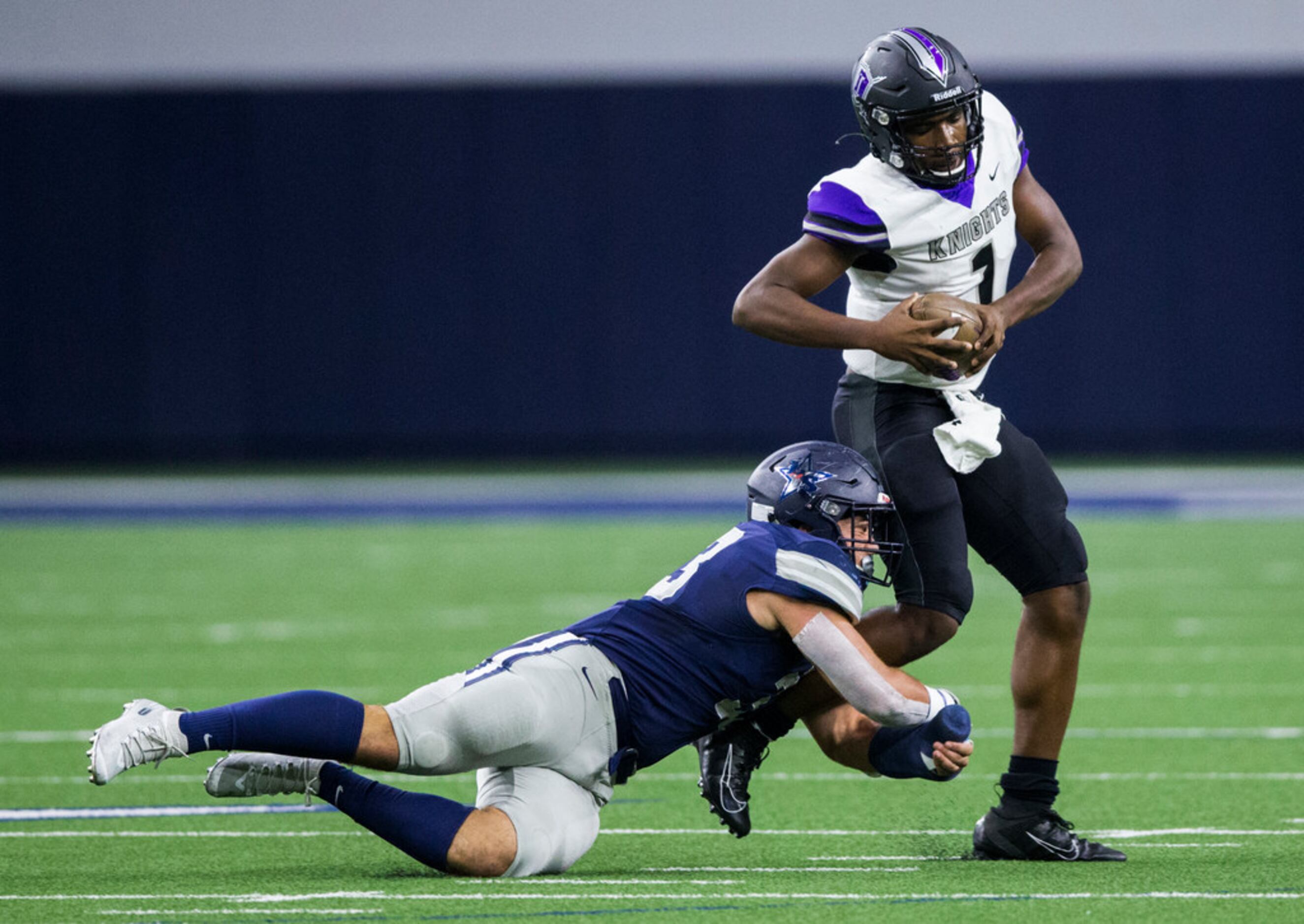 Frisco Independence quarterback Braylon Braxton (1) is tackled by Frisco Independence...