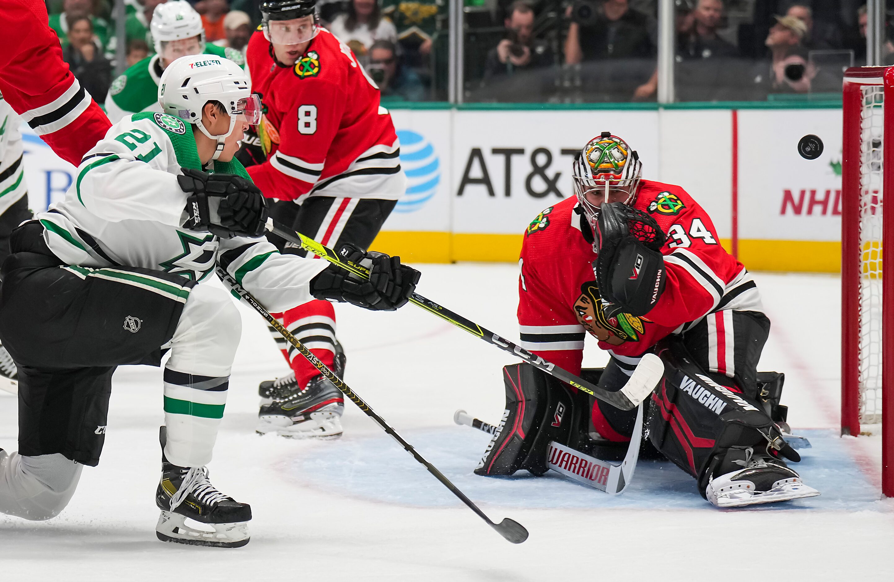 Dallas Stars left wing Jason Robertson (21) scores past Chicago Blackhawks goaltender Petr...