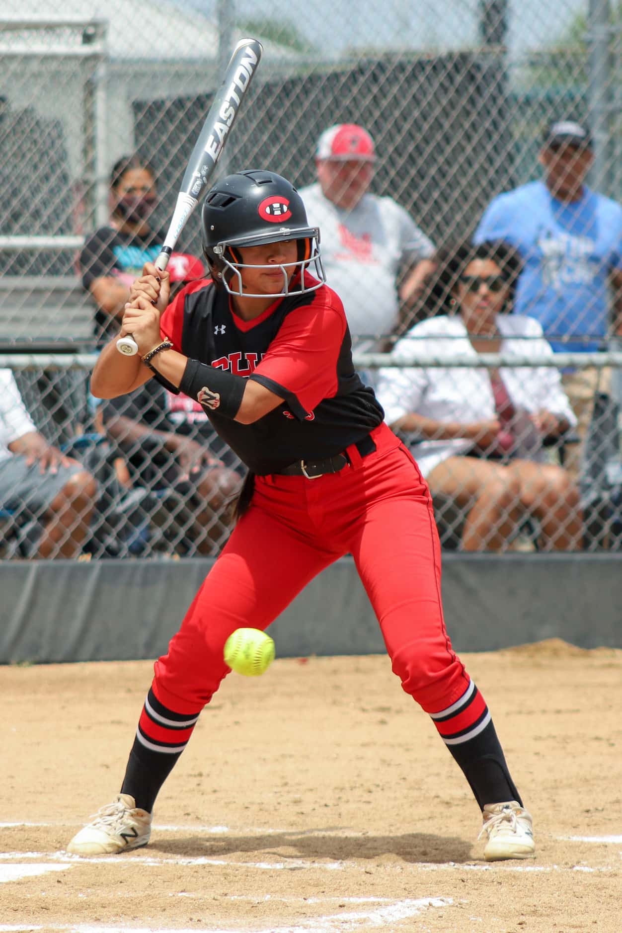 Colleyville Heritage third baseman Nia Sisneros (23) eyes a pitch during a softball Class 5A...
