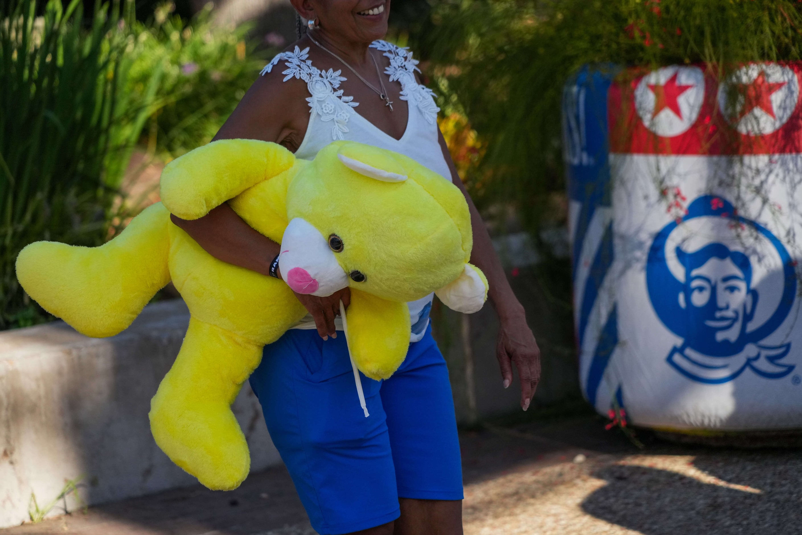 A fairgoer carries a plush toy at the State Fair of Texas on Sunday, Sept. 29, 2024, in Dallas.