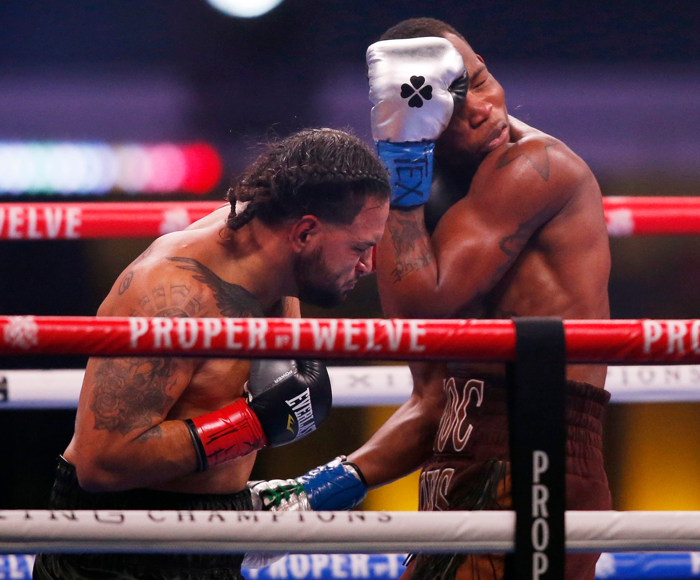 Burley Brooks takes a punch from Marco Delgado during the first round at AT&T Stadium on...