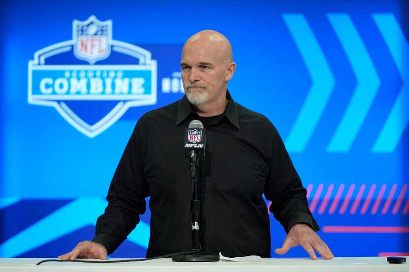 Washington Commanders head coach Dan Quinn speaks during a news conference at the NFL...