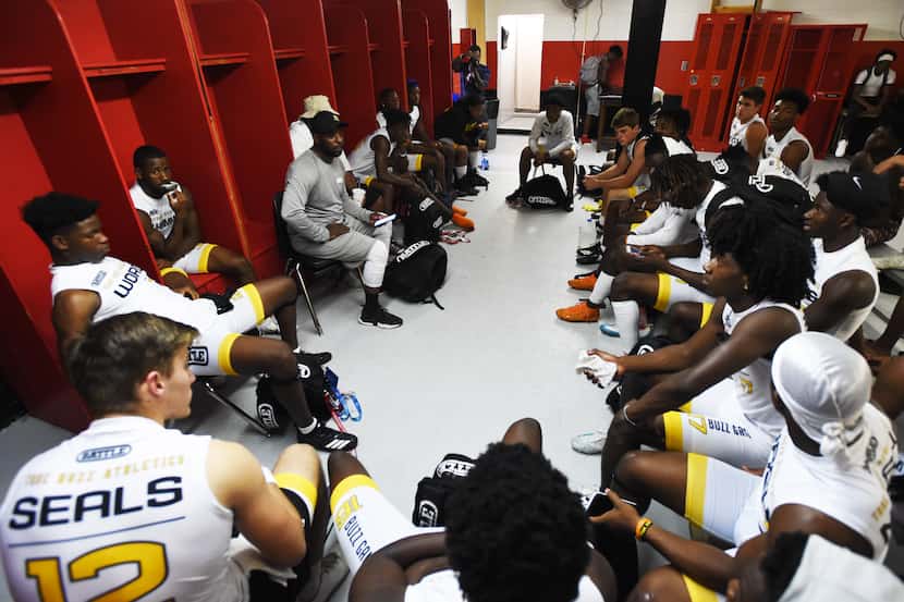 True Buzz coach Bryan Leonard gives a talk to his players in the locker room prior to the...