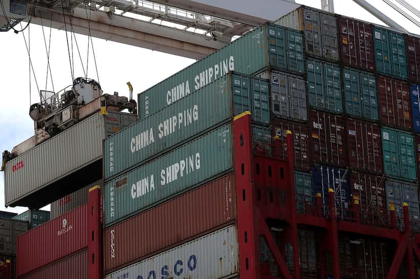 A shipping container is off-loaded from the Hong Kong-based CSCL East China Sea container...
